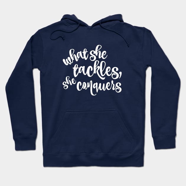 What she tackles, she conquers Hoodie by Stars Hollow Mercantile